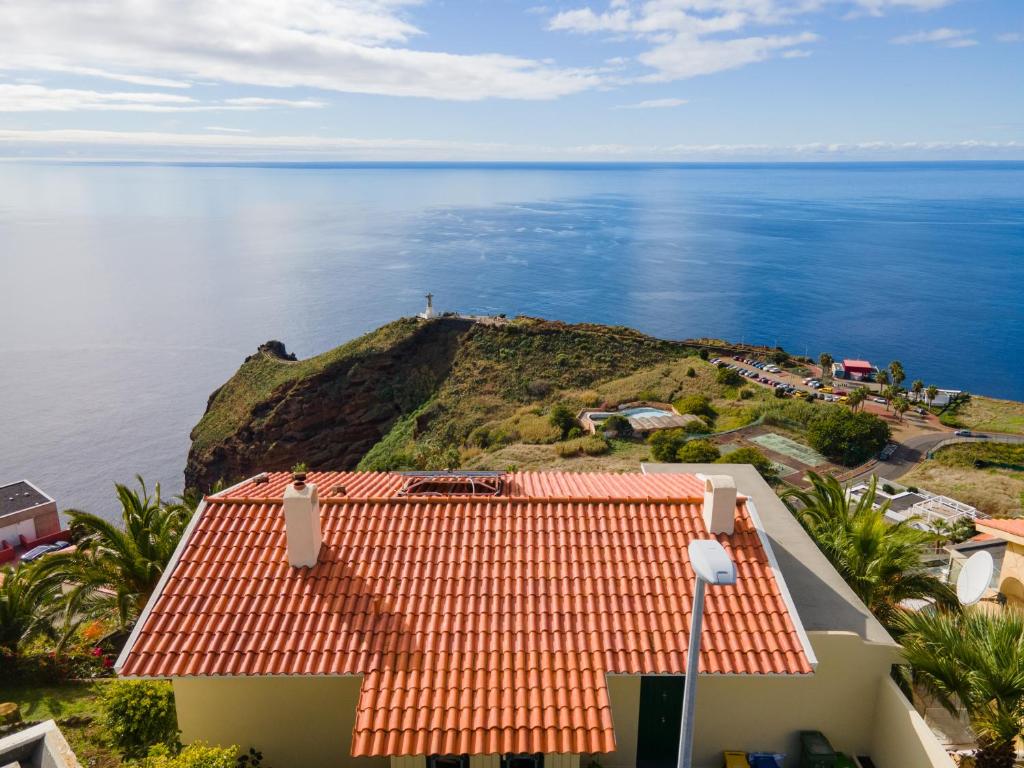 an aerial view of a house and the ocean at Garajau House - Sunrise to Sunset Ocean View Villa in Caniço