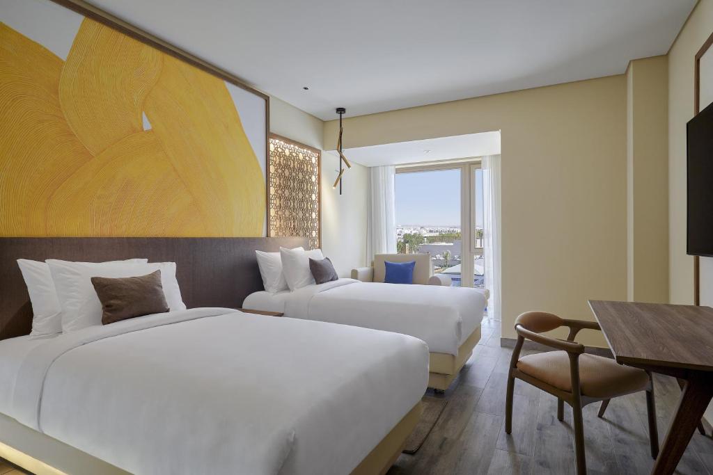 Postel nebo postele na pokoji v ubytování Hyatt Regency Cairo West