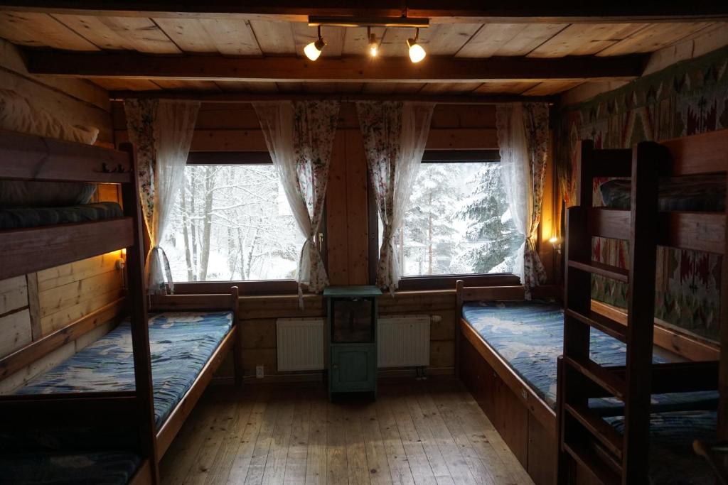 Postel nebo postele na pokoji v ubytování Good Bye Lenin Hostel Zakopane