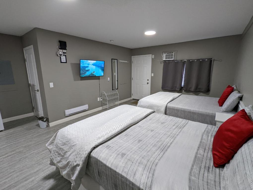 Postel nebo postele na pokoji v ubytování Riverside Motel