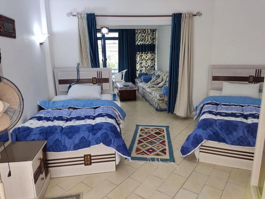 A bed or beds in a room at 2bed rooms 95m, Garden&sea view, first floor, Family only دور اول بمدخل مستقل