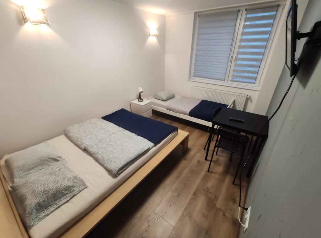 Posteľ alebo postele v izbe v ubytovaní Night Point