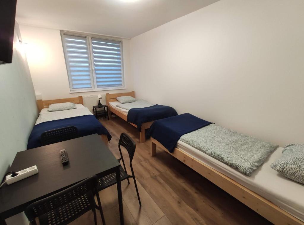Posteľ alebo postele v izbe v ubytovaní Night Point