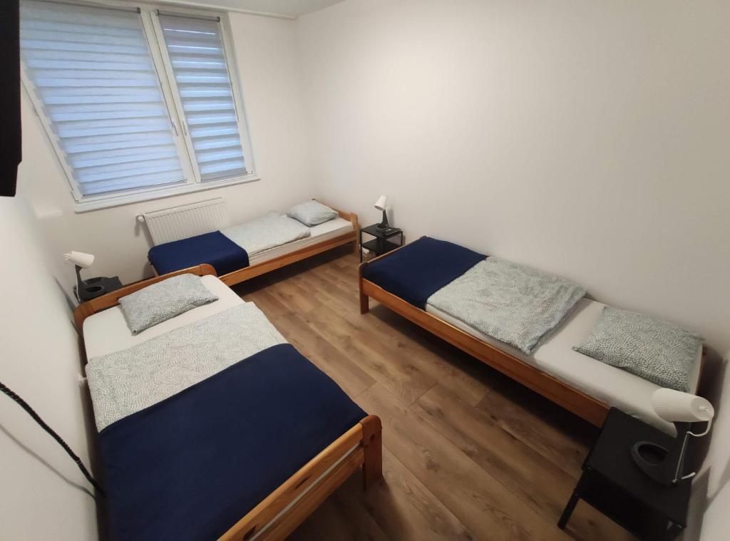 Posteľ alebo postele v izbe v ubytovaní Night Point