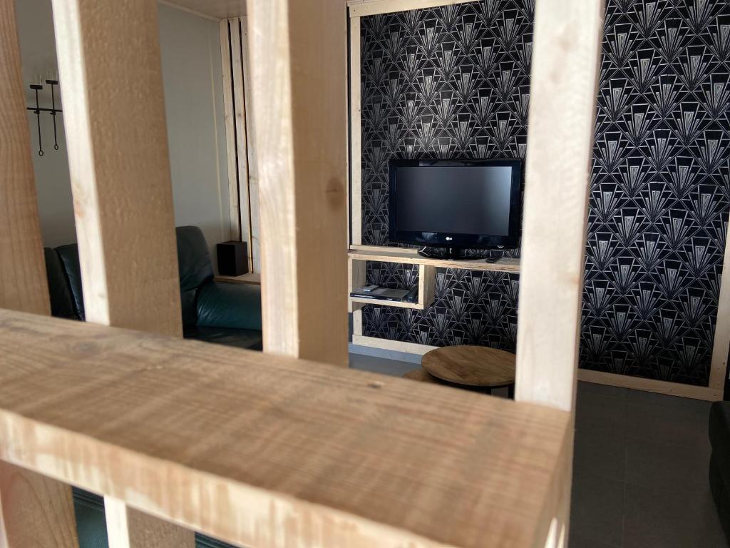 TV a/nebo společenská místnost v ubytování Gite du Moulin Iris
