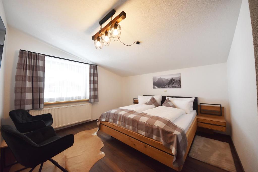 Postel nebo postele na pokoji v ubytování K-Appartements Klösterle