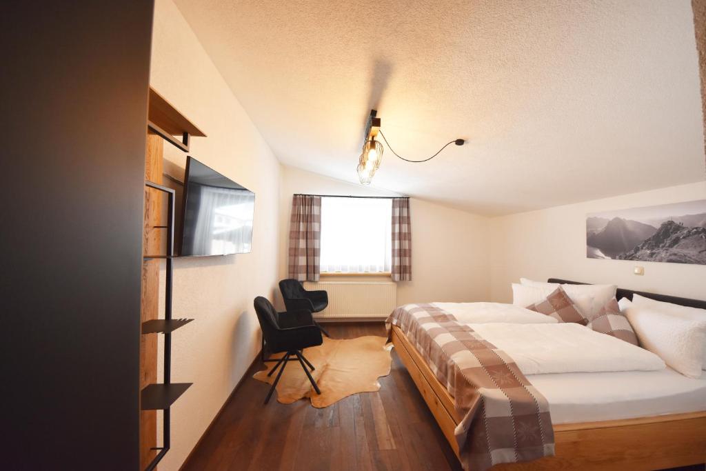 Postel nebo postele na pokoji v ubytování K-Appartements Klösterle