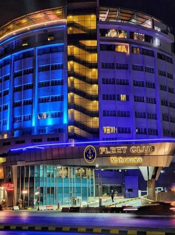 a building with blue lights on top of it at Fleet Club Mahrousa in Alexandria