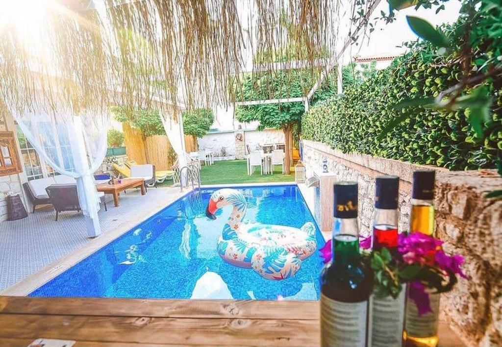 a swimming pool with a rubber duck in a yard at My Adress Alaçatı Butik Otel in Alacati