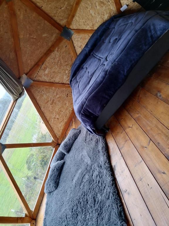 Letto o letti in una camera di Cabañas el mirador del tomine