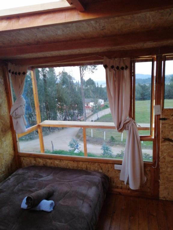 Letto o letti in una camera di Cabañas el mirador del tomine