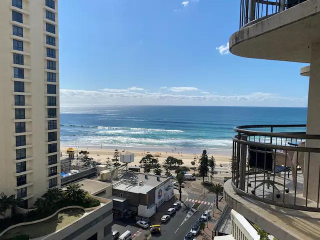 a view of the beach from the balcony of a building at U1 - Relaxing “Seaview’s” from your balcony in Gold Coast