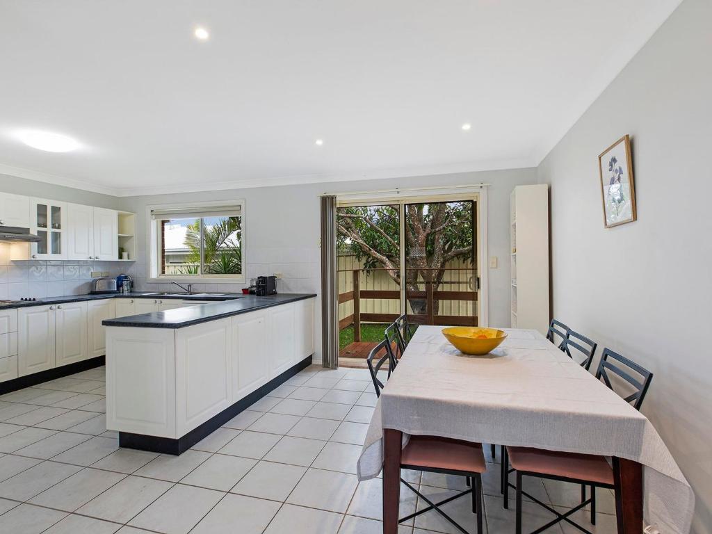 a kitchen with a table with a bowl on it at Bonnieview House in Shelly Beach