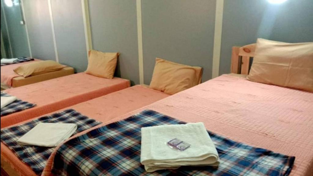 Postel nebo postele na pokoji v ubytování Pai Tewdoi ปาย ทิวดอย รีสอร์ท