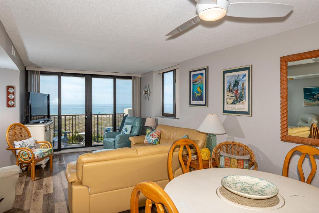 a living room with a couch and a table at Sands Villas II in Atlantic Beach