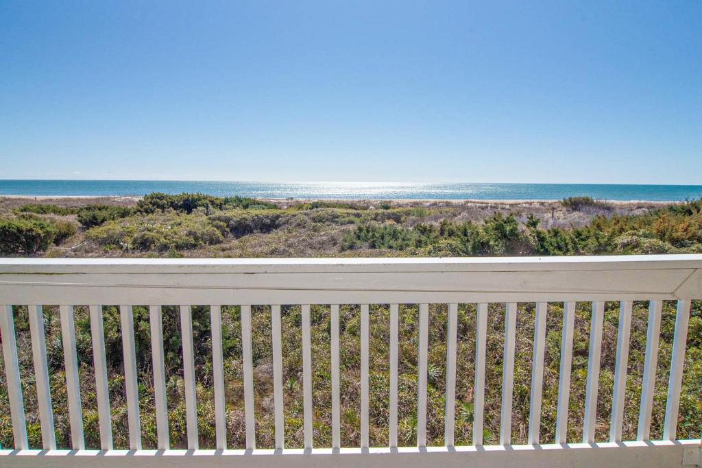 a balcony with a view of the ocean at A Place At The Beach IV in Atlantic Beach
