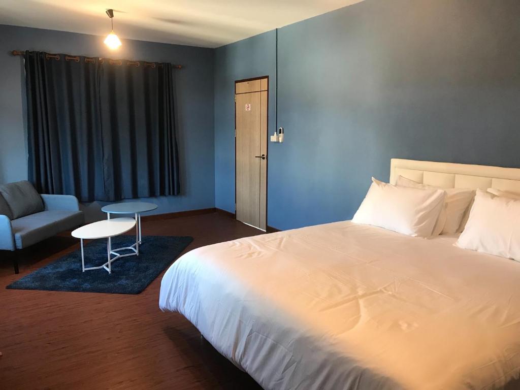 Postel nebo postele na pokoji v ubytování Benja369 บ้านเบญจา
