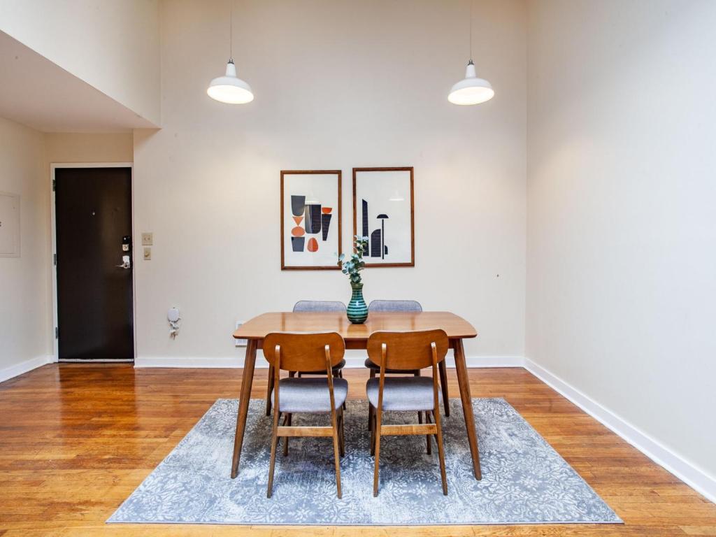 a dining room with a table and two chairs at Spacious Old City Loft in Knoxville