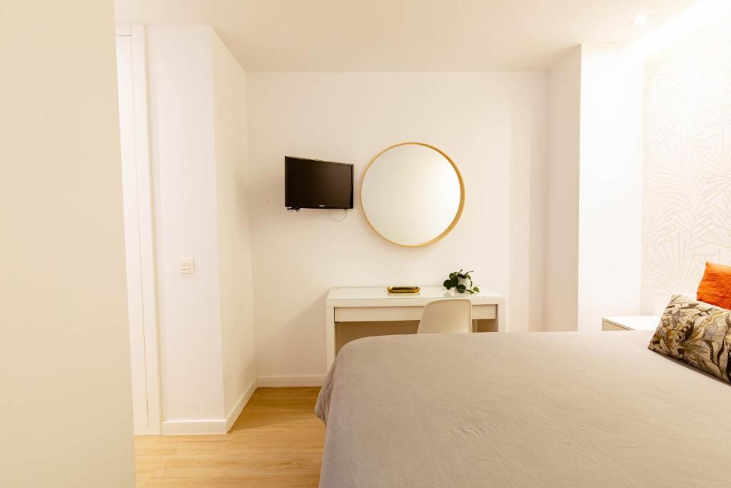 Postel nebo postele na pokoji v ubytování Apartamentos Deluxe Strada