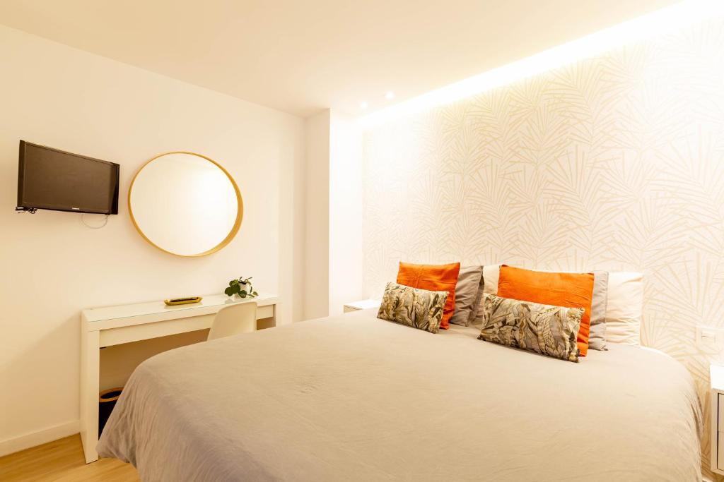 Postel nebo postele na pokoji v ubytování Apartamentos Deluxe Strada