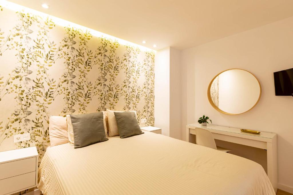 Postel nebo postele na pokoji v ubytování Apartamentos Deluxe Strada