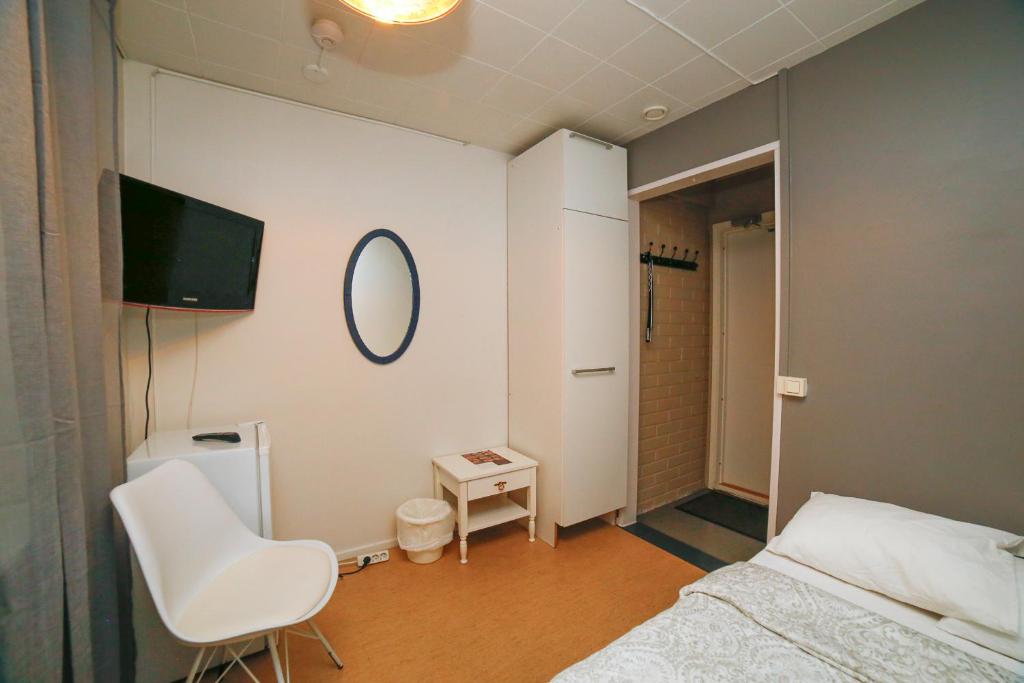 Postel nebo postele na pokoji v ubytování Motel Tornio