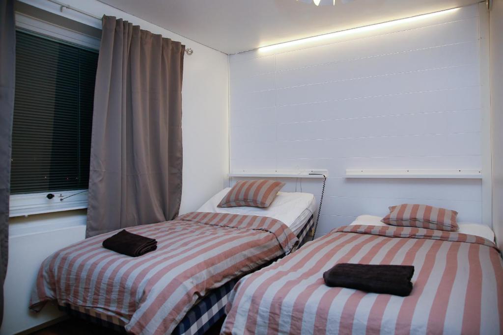 Postel nebo postele na pokoji v ubytování Motel Tornio
