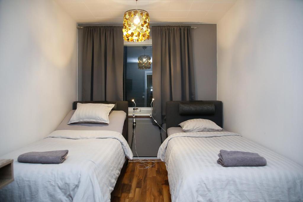 Postel nebo postele na pokoji v ubytování Motel Tornio