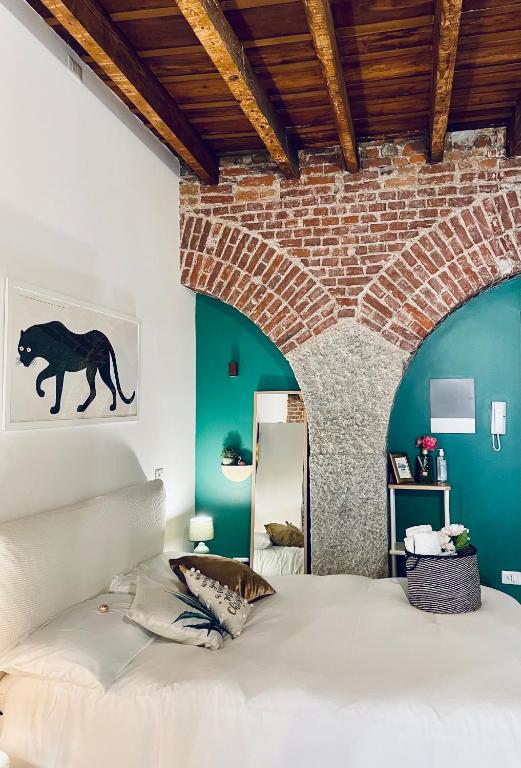 Łóżko lub łóżka w pokoju w obiekcie Ripa Apartments Milano - Ripa 57