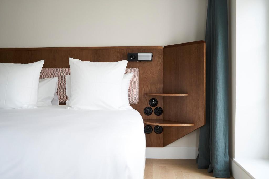 Postel nebo postele na pokoji v ubytování Hôtel du Sentier