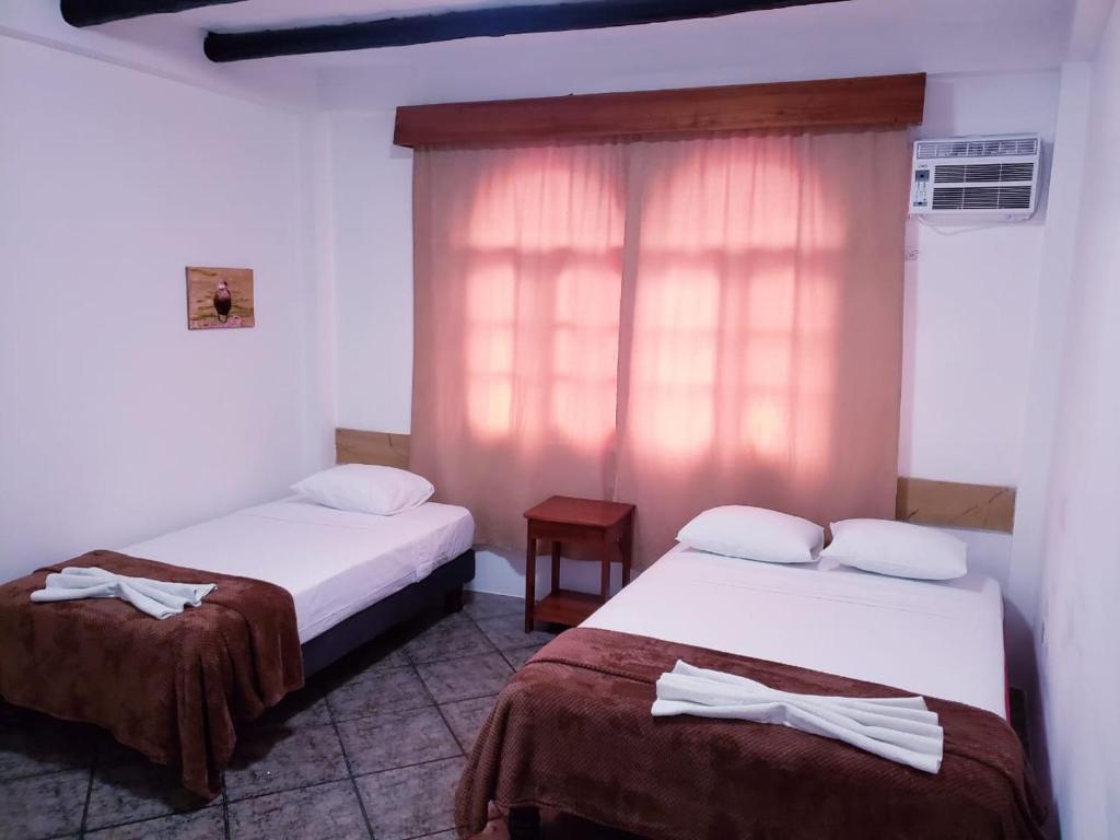 Postel nebo postele na pokoji v ubytování Hotel Crossman
