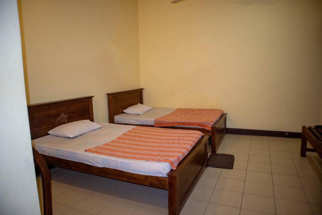 Postel nebo postele na pokoji v ubytování Chamaya Holiday Inn