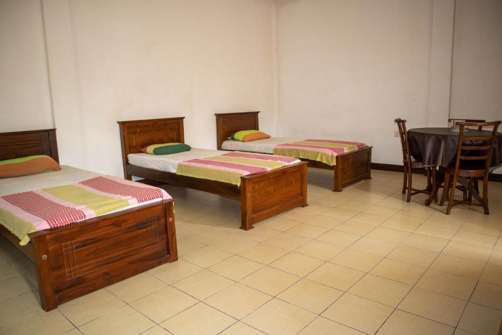 Postel nebo postele na pokoji v ubytování Chamaya Holiday Inn