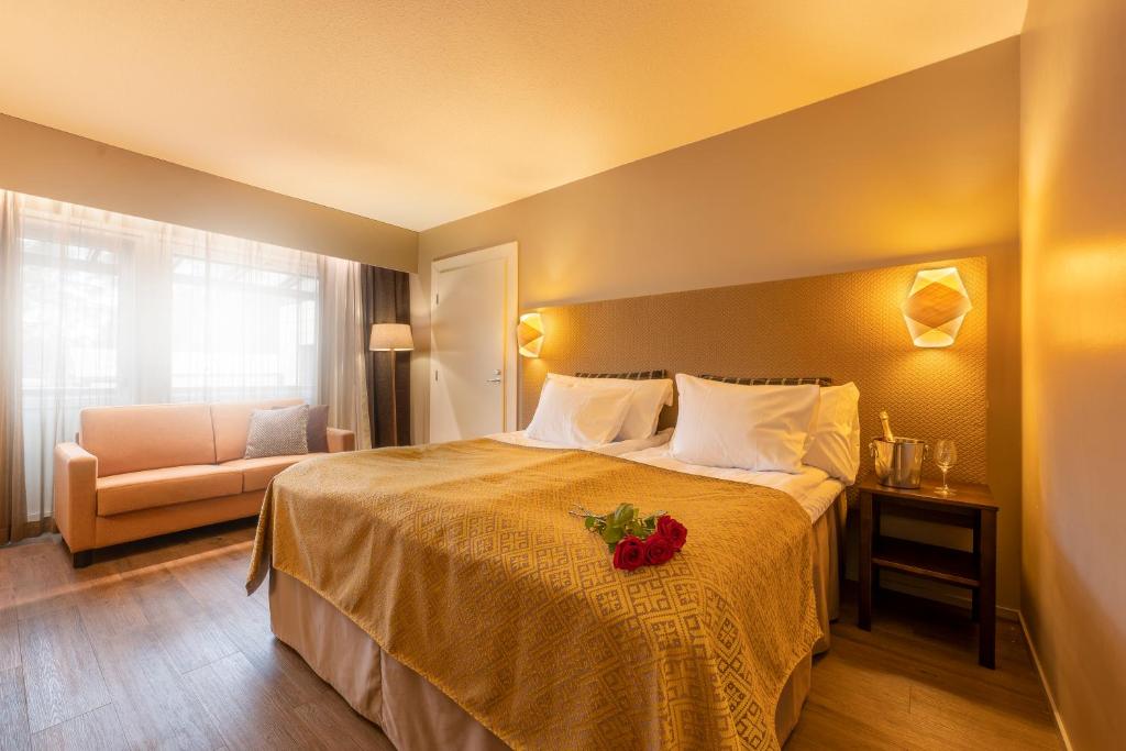 Säng eller sängar i ett rum på Spa Hotel Runni Iisalmi