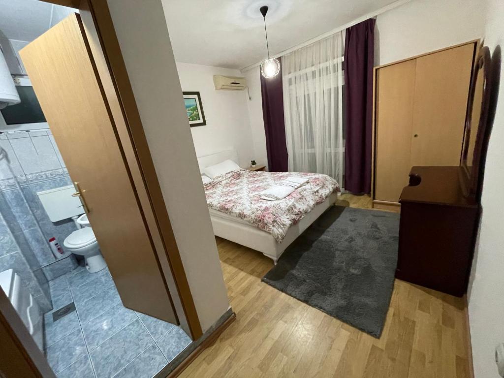 Postel nebo postele na pokoji v ubytování Apartments Dibra