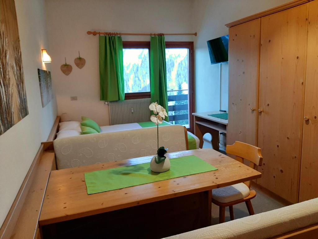 Televízia a/alebo spoločenská miestnosť v ubytovaní Casa AQ28 sulle piste da sci