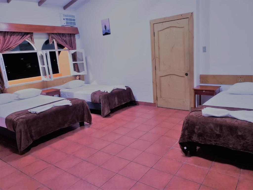 Postel nebo postele na pokoji v ubytování Hotel Crossman
