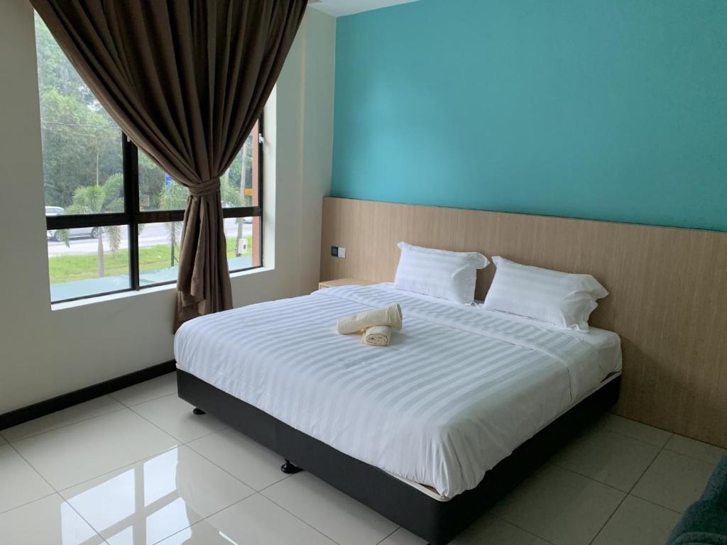 Postel nebo postele na pokoji v ubytování M Quality Hotel