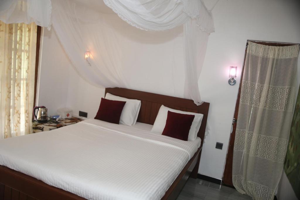 Postel nebo postele na pokoji v ubytování Cinnamon Homestay ella