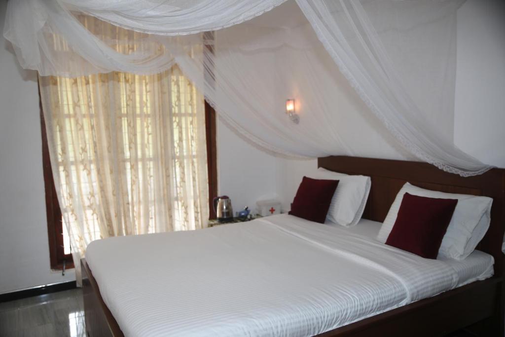 Postel nebo postele na pokoji v ubytování Cinnamon Homestay ella