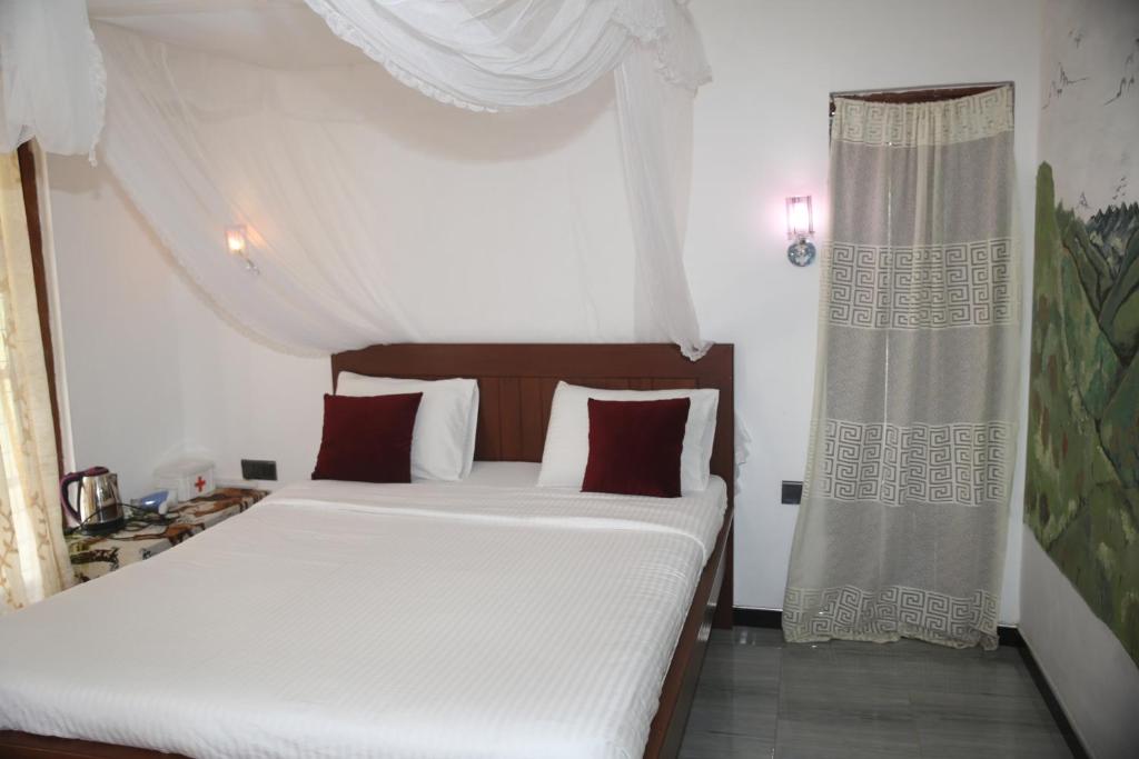 Postel nebo postele na pokoji v ubytování Cinnamon Homestay ella