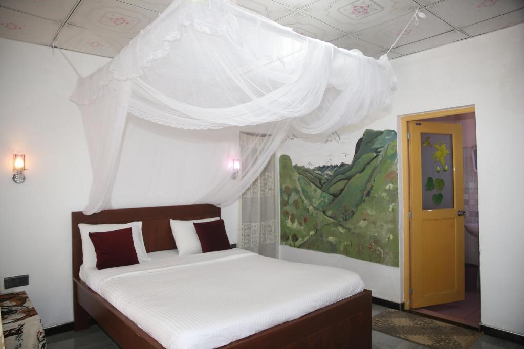 Postel nebo postele na pokoji v ubytování Cinnamon Homestay ella