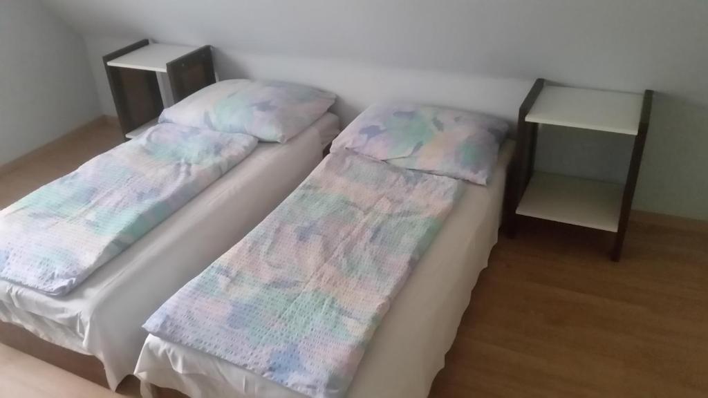 A bed or beds in a room at F 106 Vendégház