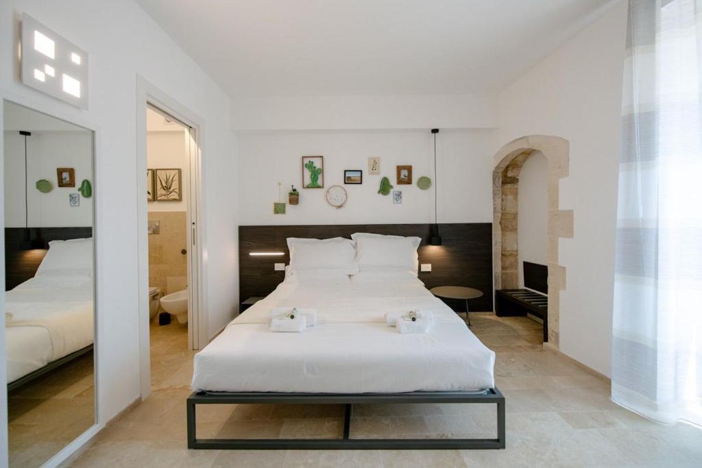 Postel nebo postele na pokoji v ubytování IBLA ROOMS