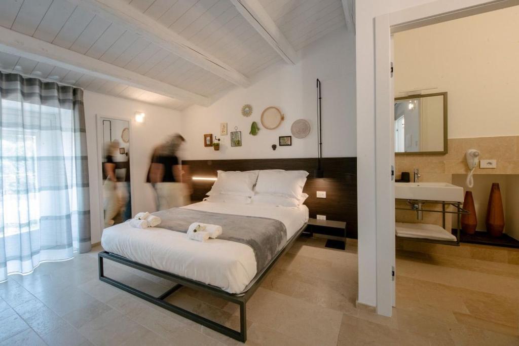 Postel nebo postele na pokoji v ubytování IBLA ROOMS