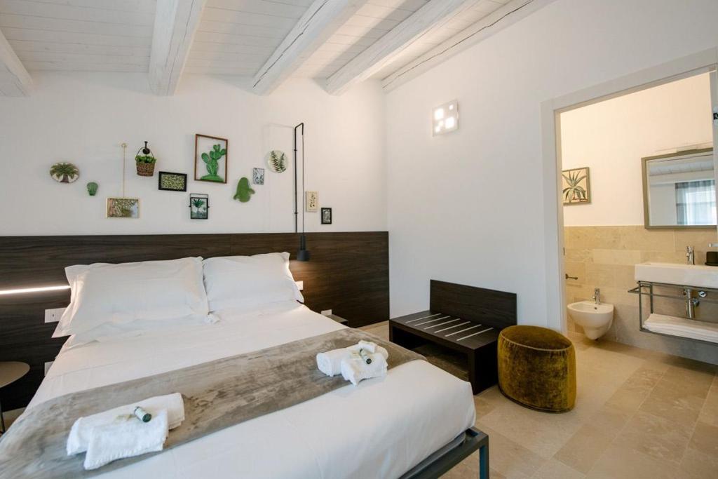Postel nebo postele na pokoji v ubytování IBLA ROOMS