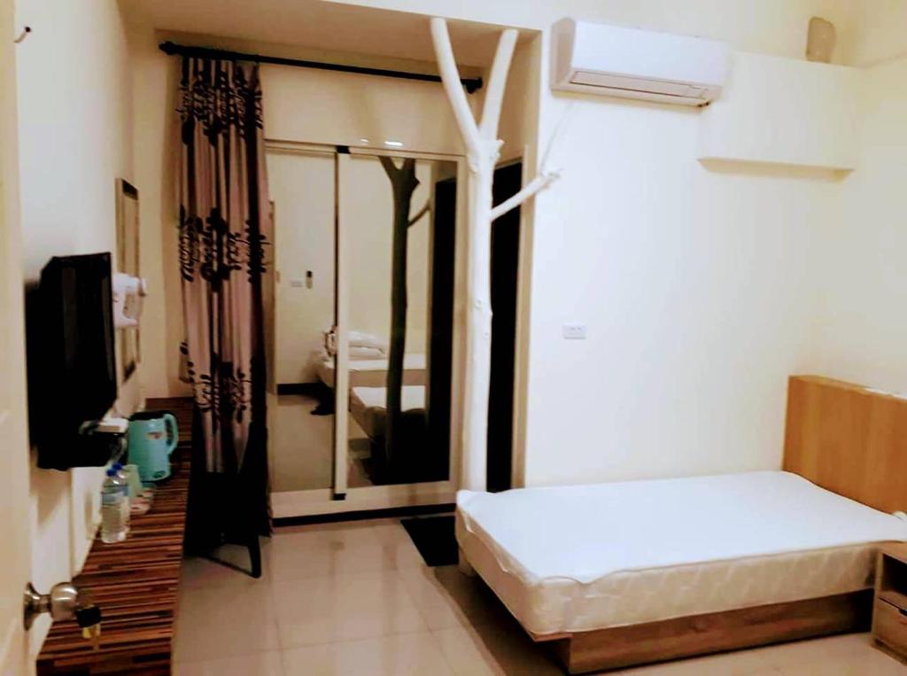 Letto o letti in una camera di Plum Green Homestay