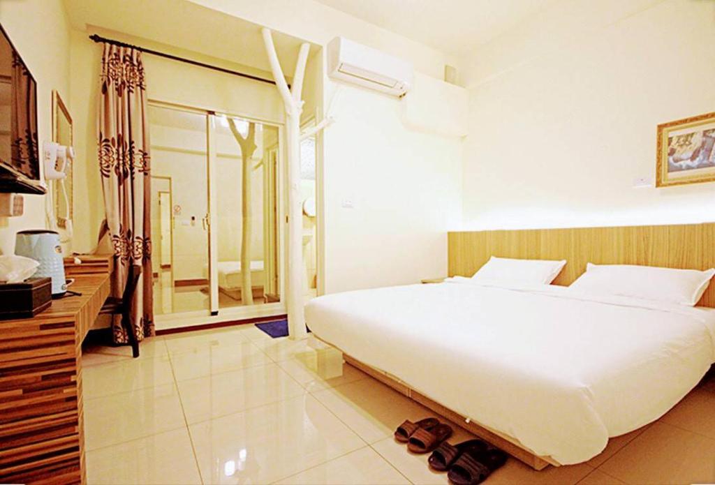 Letto o letti in una camera di Plum Green Homestay