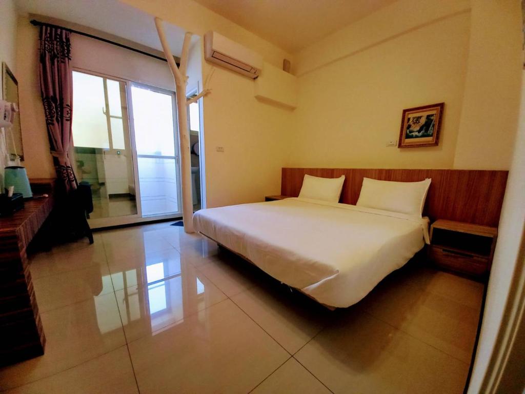Letto o letti in una camera di Plum Green Homestay