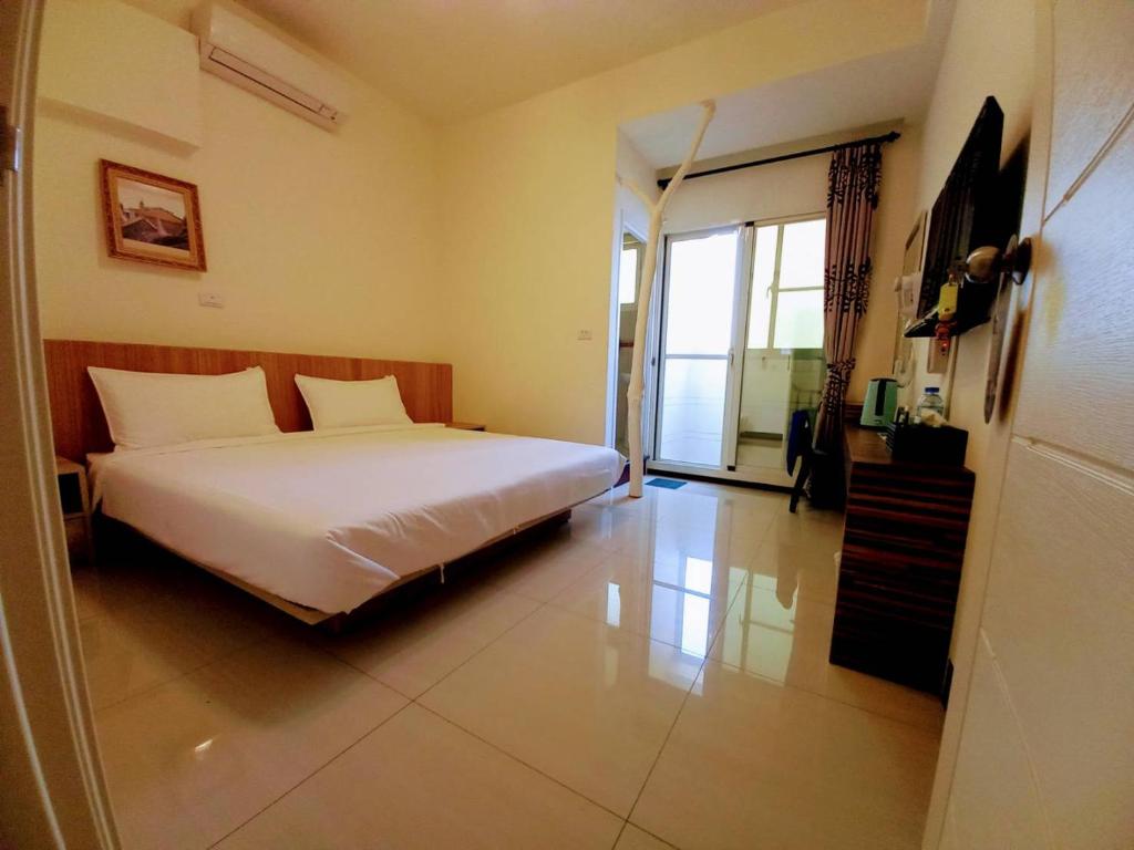 Letto o letti in una camera di Plum Green Homestay